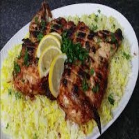 نصف دجاج على الفحم مع الرز